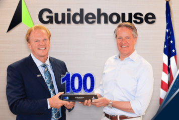 Guidehouse CEO Scott McIntyre Accepts 2024 Wash100 Award From Jim Garrettson